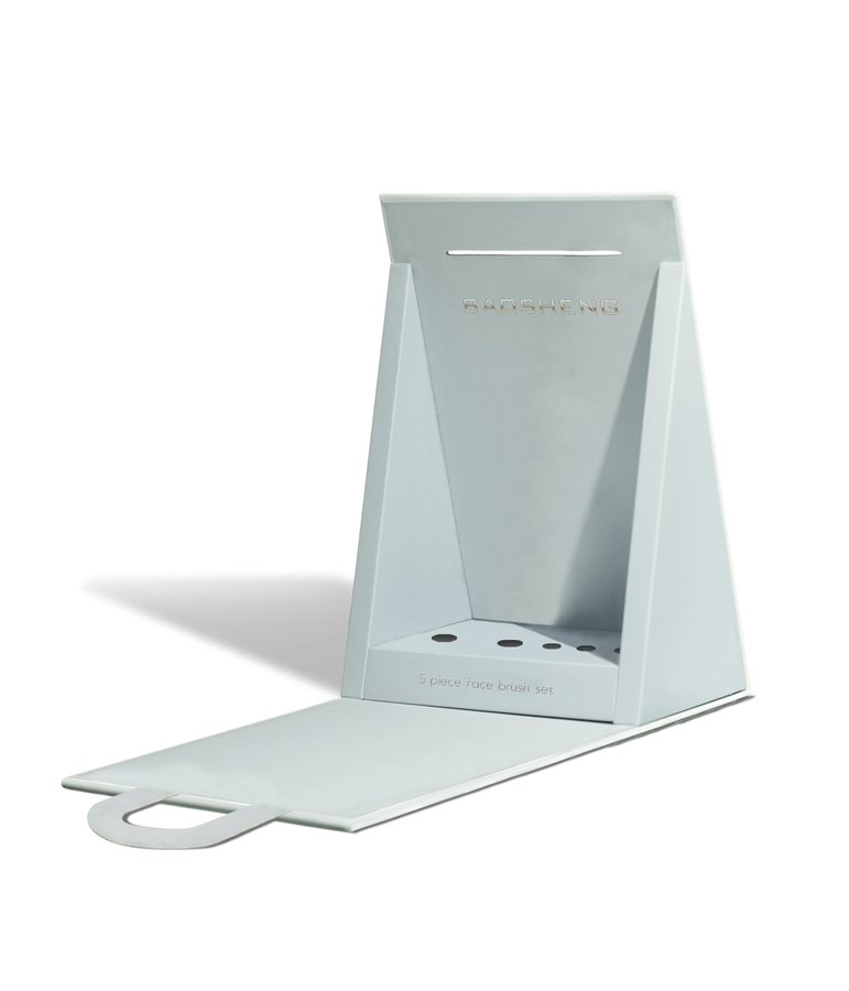 Pale blue fold-flat counter display with a brush tray