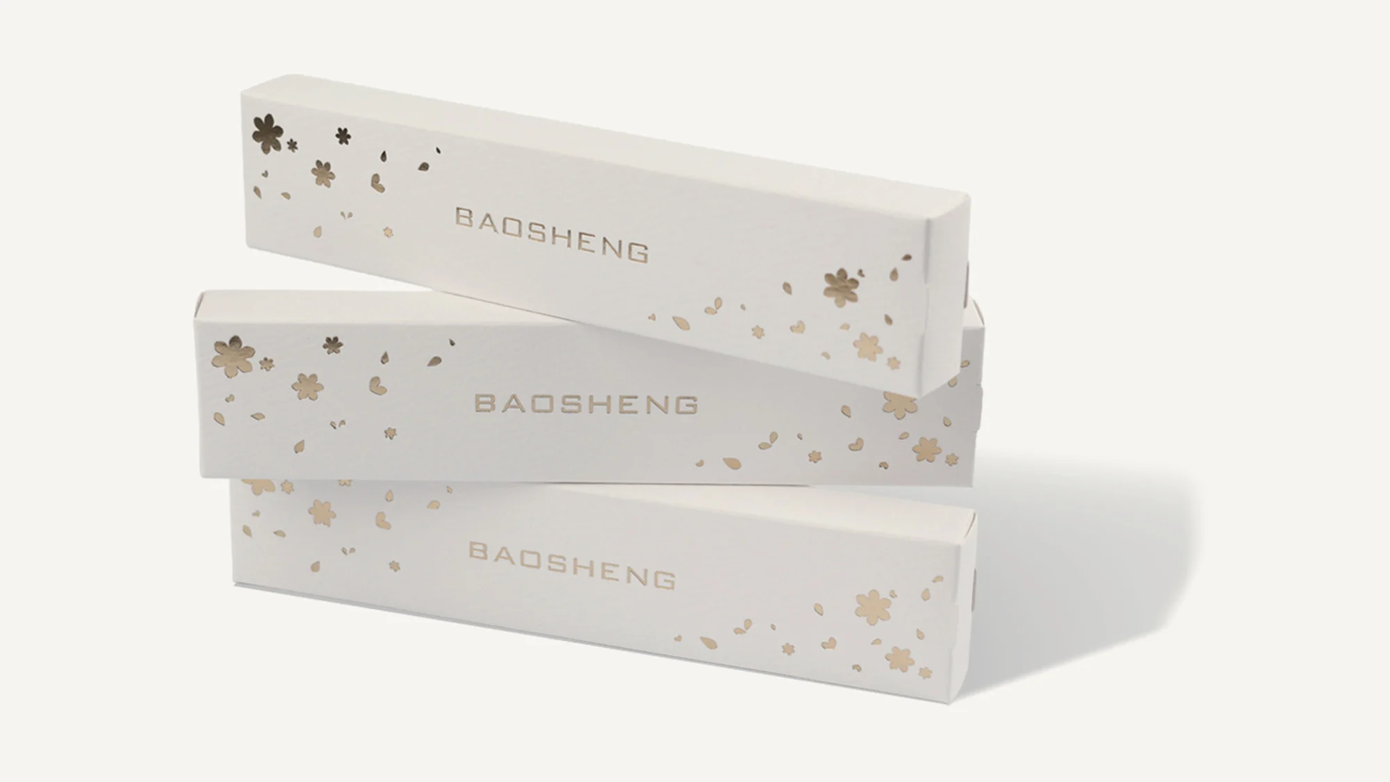 Three white boxes with gold stars