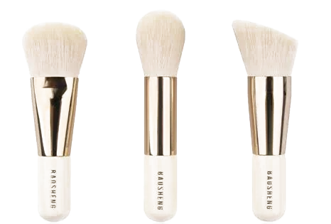 Three gold-and-ivory travel brushes